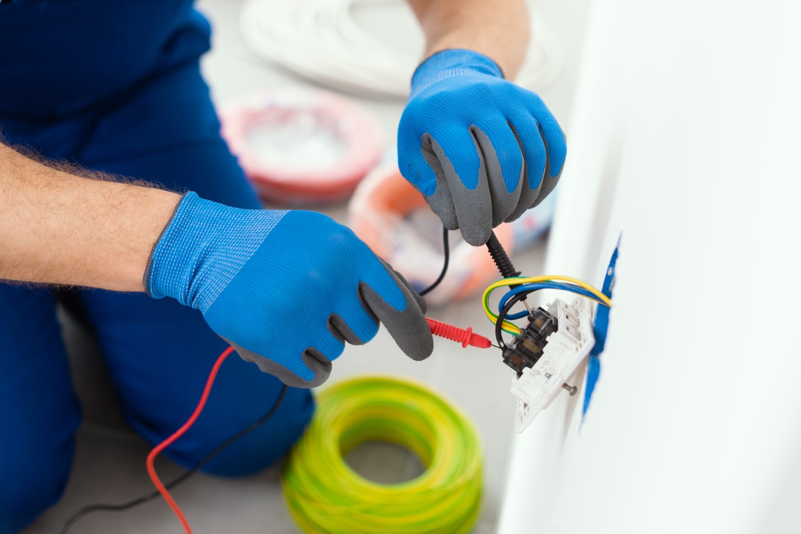 general electrician testing outlet